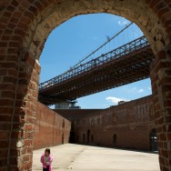 a young girl dancing in an empty abandoned warehouse in Brooklyn, New York, USA