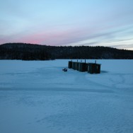 fishing sheds on a frozen lake in the Laurentides Natural Park outside of Montreal, Canada