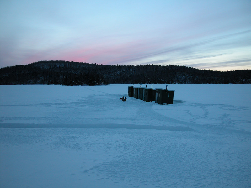 fishing sheds on a frozen lake in the Laurentides Natural Park outside of Montreal, Canada