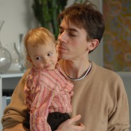 Olivier holding Jeanne in his arms in Paris, France