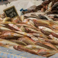 red mullets fresh from the boat displayed on a fishmonger stand at the Marche Forville in Cannes, France